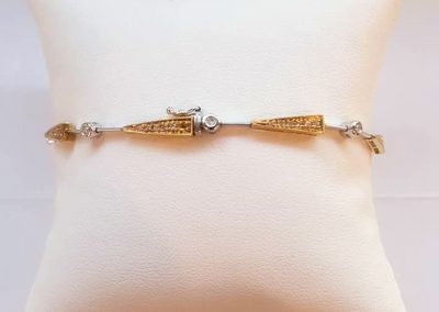 Custom-made two-tone white and yellow gold diamond bracelet.