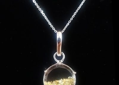 Unique 14 carat white gold shaker pendant with fancy yellow baguettes diamonds and quartz.